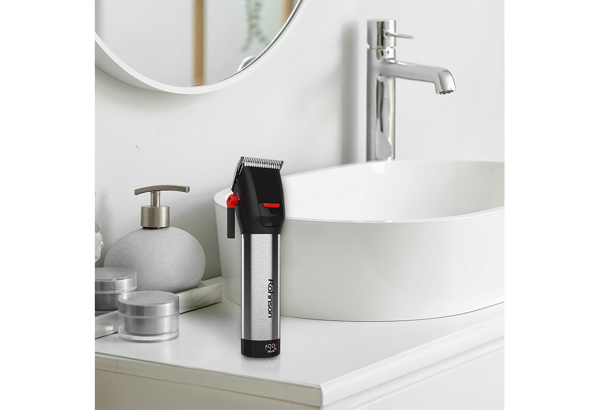 Απεικονίζεται η μηχανή δίπλα σε νιπτήρα.